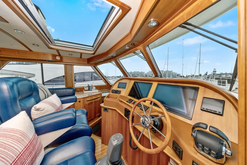 Second Rodeo Yacht Photos Pics Interior of 2018 Sabre 48 Salon Express yacht with luxurious seating and navigation controls.