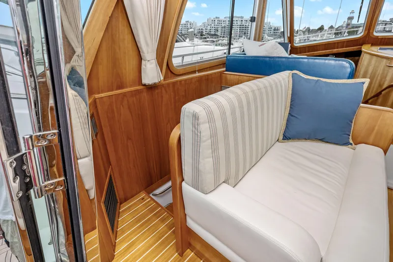 Second Rodeo Yacht Photos Pics Interior of 2018 Sabre 48 Salon Express yacht with elegant seating and wood finish.
