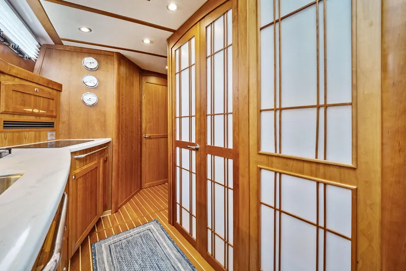 Second Rodeo Yacht Photos Pics 2018 Sabre 48 Salon Express interior with wooden cabinetry and modern design.