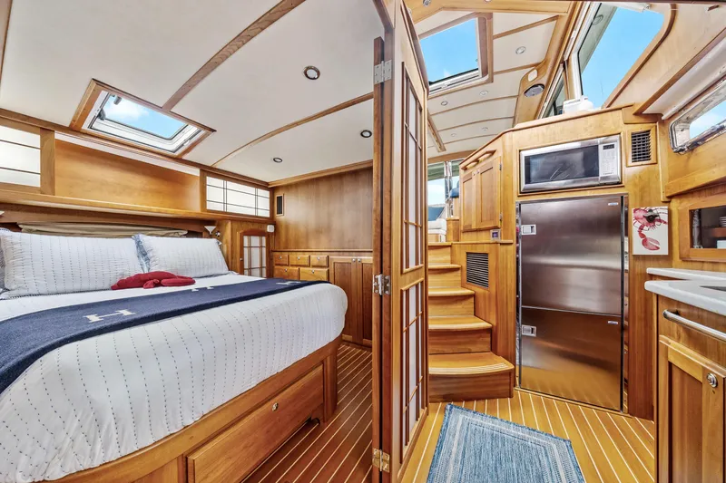 Second Rodeo Yacht Photos Pics Luxurious interior of 2018 Sabre 48 Salon Express yacht with wood finishes and modern amenities.