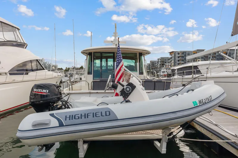 Second Rodeo Yacht Photos Pics 2018 Sabre 48 Salon Express yacht with Highfield tender at marina.
