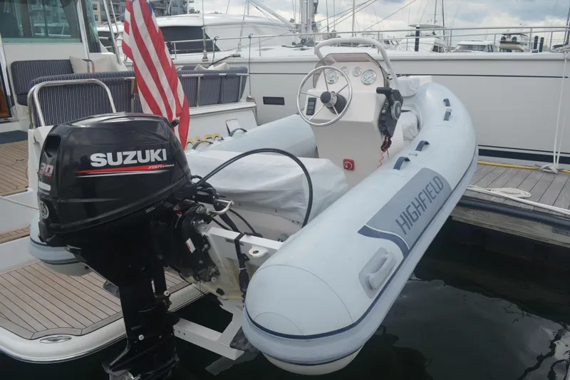 Second Rodeo Yacht Photos Pics Inflatable boat with Suzuki outboard motor on 2018 Sabre 48 Salon Express yacht.
