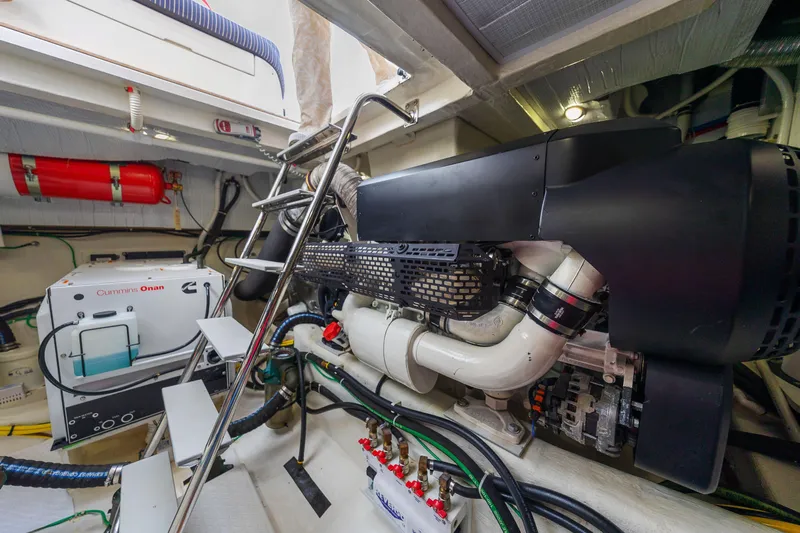 Second Rodeo Yacht Photos Pics Engine room of 2018 Sabre 48 Salon Express with Cummins Onan generator and fire extinguisher.