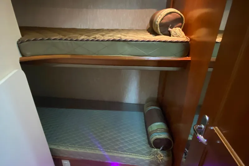 Carousel Yacht Photos Pics 2007 Silverton 36 Convertible yacht interior with cozy bunk beds and elegant wood finish.