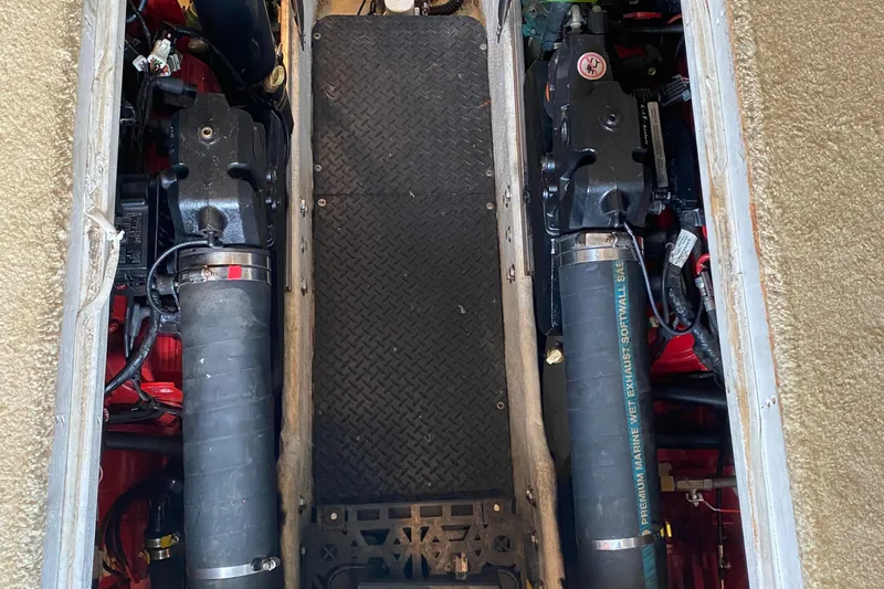 Carousel Yacht Photos Pics Engine compartment of a 2007 Silverton 36 Convertible boat, showcasing dual engines.