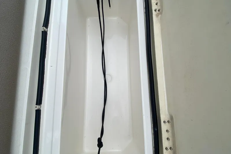 Carousel Yacht Photos Pics Storage compartment of a 2007 Silverton 36 Convertible boat, featuring a clean interior.