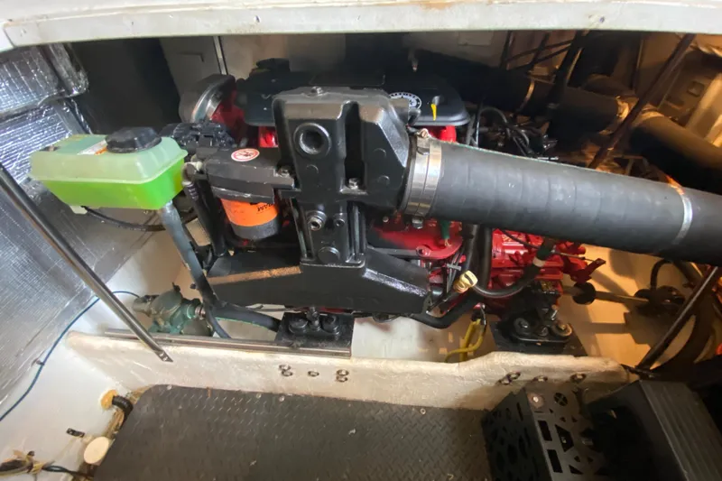 Carousel Yacht Photos Pics Engine compartment of a 2007 Silverton 36 Convertible boat, showcasing mechanical components.