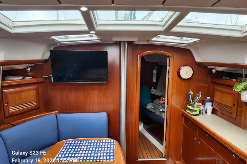 Little Su Yacht Photos Pics Interior of 2005 Beneteau Oceanis Clipper 393 yacht with wood finish and skylights.