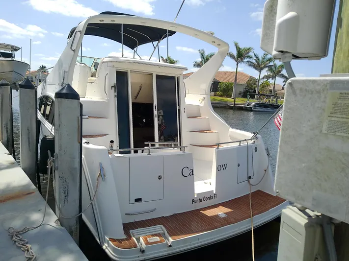 Cash Flow Yacht Photos Pics 2005 Carver 36 Mariner docked, featuring spacious deck and sleek design.