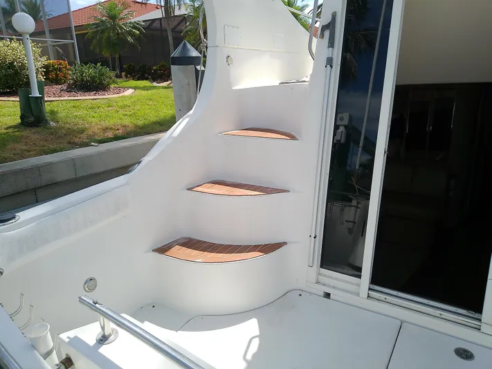 Cash Flow Yacht Photos Pics Staircase on 2005 Carver 36 Mariner yacht, featuring wooden steps and sleek design.