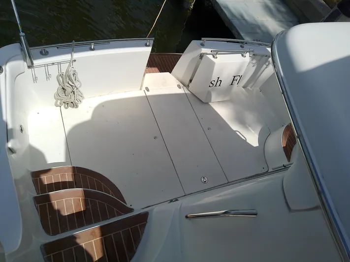 Cash Flow Yacht Photos Pics 2005 Carver 36 Mariner boat deck with seating and dock view.