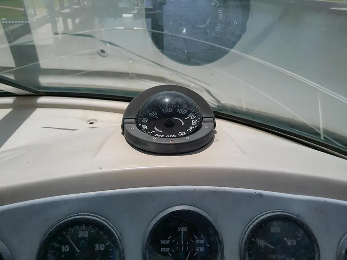 Cash Flow Yacht Photos Pics Compass and gauges on 2005 Carver 36 Mariner boat dashboard.