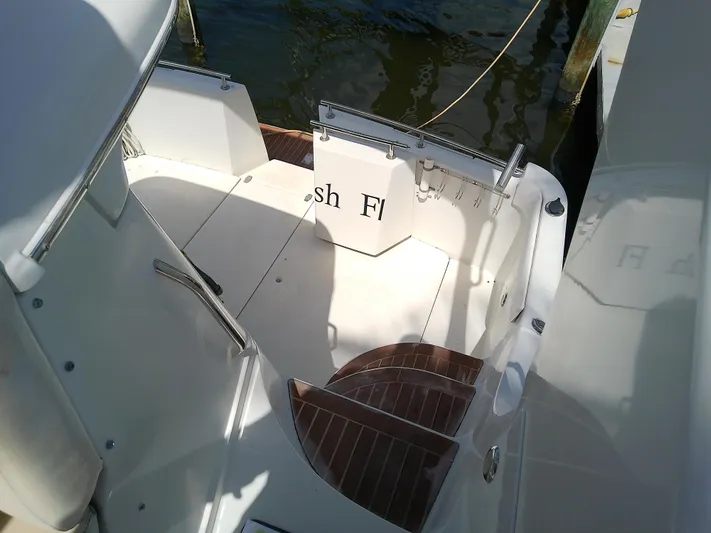 Cash Flow Yacht Photos Pics 2005 Carver 36 Mariner boat deck with wooden steps and water view.