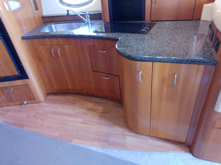 Cash Flow Yacht Photos Pics 2005 Carver 36 Mariner kitchen with wood cabinets and granite countertop.