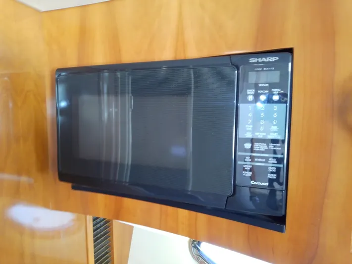 Cash Flow Yacht Photos Pics Sharp microwave in 2005 Carver 36 Mariner yacht kitchen.