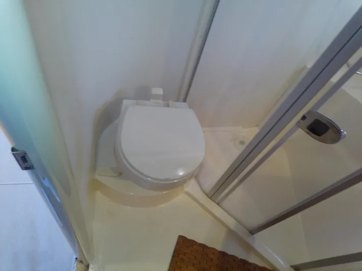 Cash Flow Yacht Photos Pics Bathroom in 2005 Carver 36 Mariner yacht with toilet and shower.