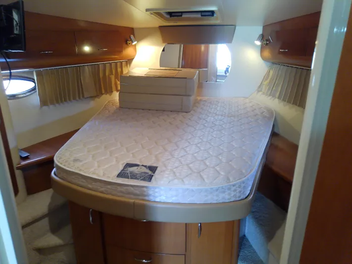 Cash Flow Yacht Photos Pics Interior cabin of 2005 Carver 36 Mariner yacht with bed and storage.