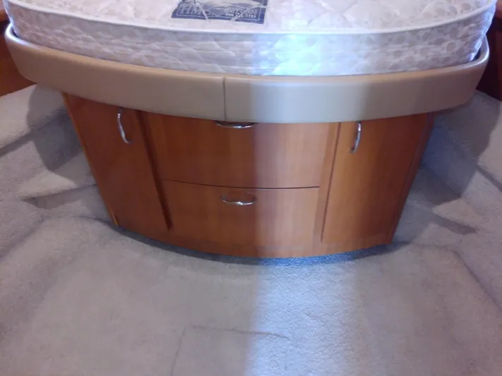 Cash Flow Yacht Photos Pics Interior of 2005 Carver 36 Mariner with wooden cabinetry and bed.