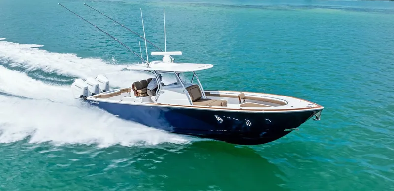 Galati Yacht Sales Trade Yacht Photos Pics 2024 Valhalla Boatworks V-37 cruising on clear blue water, showcasing sleek design and powerful engines.