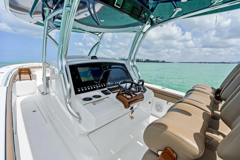 Galati Yacht Sales Trade Yacht Photos Pics 2024 Valhalla Boatworks V-37 helm with modern controls, beige seating, and ocean view.