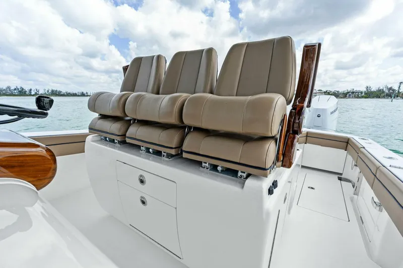 Galati Yacht Sales Trade Yacht Photos Pics 2024 Valhalla Boatworks V-37 with luxurious seating, featuring three tan leather chairs on deck.