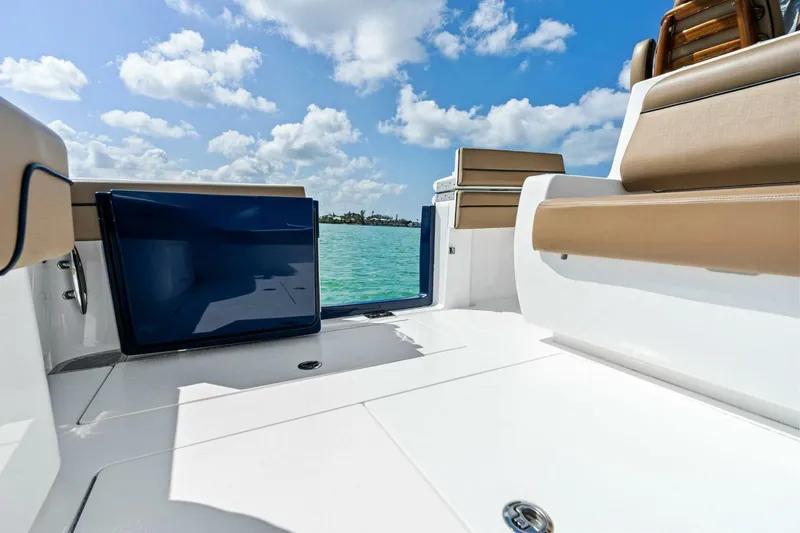 Galati Yacht Sales Trade Yacht Photos Pics 2024 Valhalla Boatworks V-37 deck with seating, open water view, and clear blue sky.