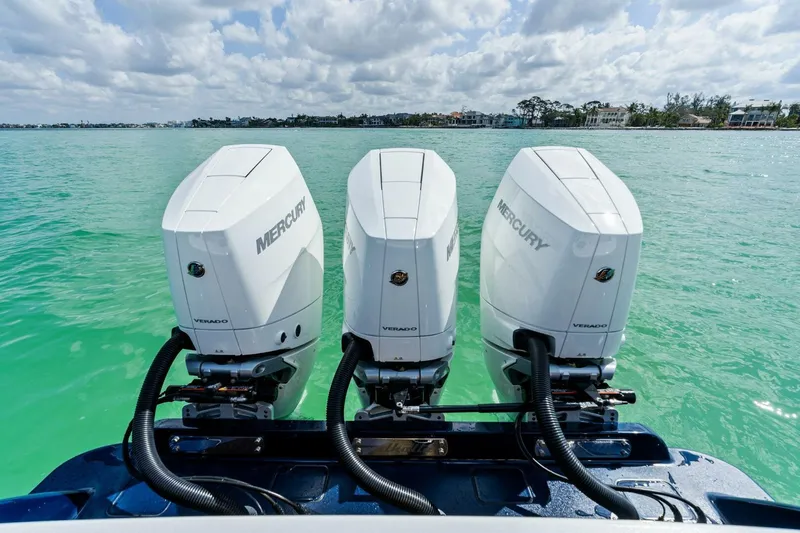 Galati Yacht Sales Trade Yacht Photos Pics 2024 Valhalla V-37 boat with triple Mercury outboard engines on turquoise water.