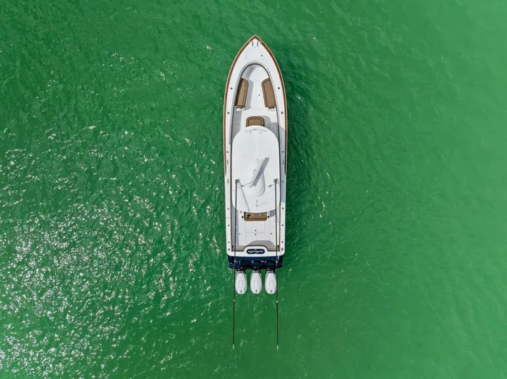 Galati Yacht Sales Trade Yacht Photos Pics Aerial view of 2024 Valhalla Boatworks V-37 on vibrant green water.