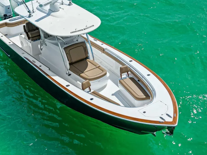 Galati Yacht Sales Trade Yacht Photos Pics 2024 Valhalla Boatworks V-37 on turquoise water, showcasing sleek design and luxury seating.