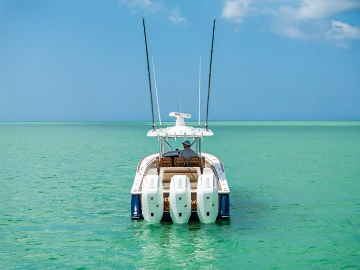 Galati Yacht Sales Trade Yacht Photos Pics 2024 Valhalla Boatworks V-37 on turquoise water, rear view with triple engines.