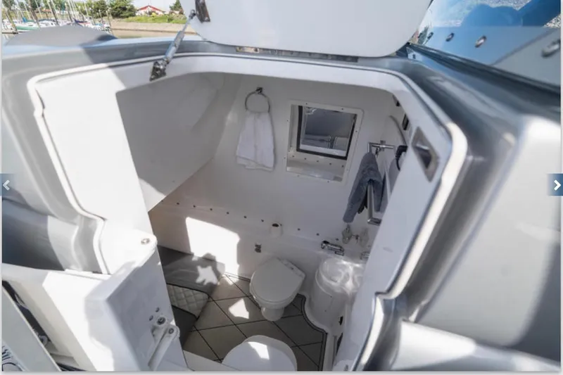  Yacht Photos Pics 2020 Midnight Express 37 Open boat interior bathroom with modern amenities.