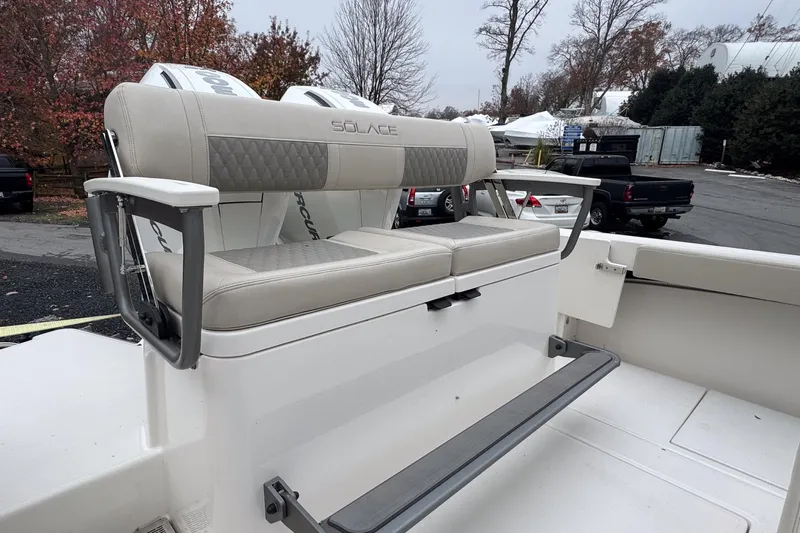  Yacht Photos Pics 2025 Solace 30 HCS boat seating with armrests, outdoor setting.