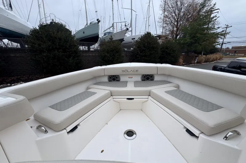  Yacht Photos Pics 2025 Solace 30 HCS boat interior with cushioned seating and sleek design.