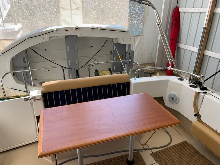  Yacht Photos Pics 2014 Ranger Tugs Trawler interior with wooden table and seating.