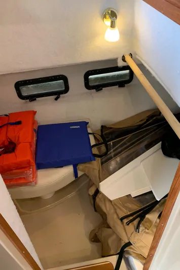  Yacht Photos Pics 2014 Ranger Tugs Trawler interior storage area with life jackets and supplies.