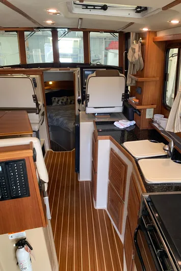  Yacht Photos Pics Interior of a 2014 Ranger Tugs Trawler with wood flooring and modern amenities.