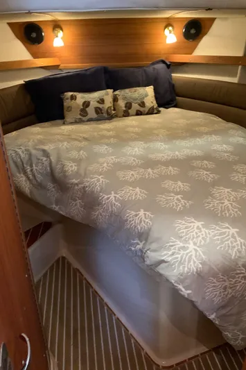  Yacht Photos Pics 2014 Ranger Tugs Trawler cozy bedroom with nautical-themed bedding.