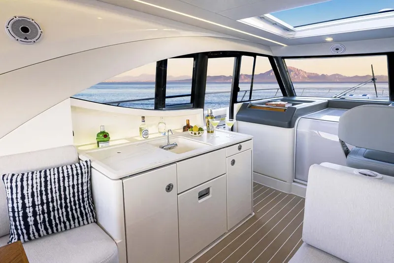 Yacht Photos Pics Manufacturer Provided Image: Luxurious interior of 2026 Riviera 4300 Sport Express yacht with ocean view.