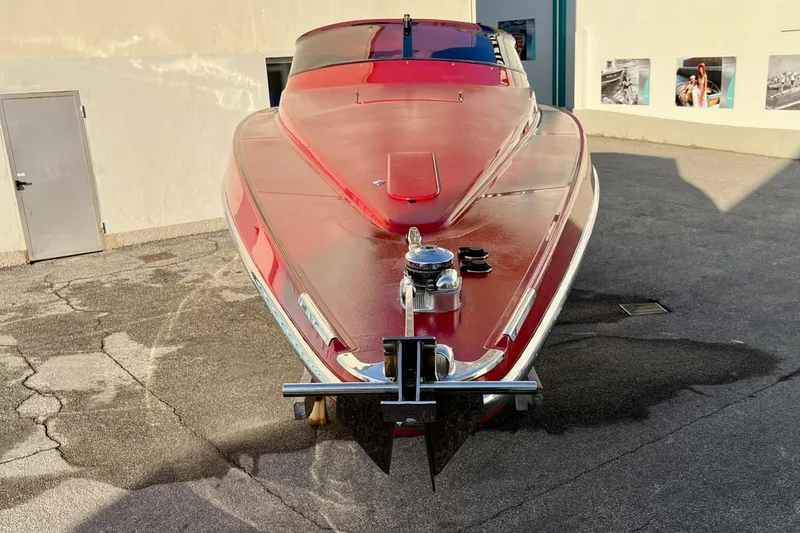  Yacht Photos Pics Red 1994 Riva 32 Ferrari Special boat parked on concrete surface.