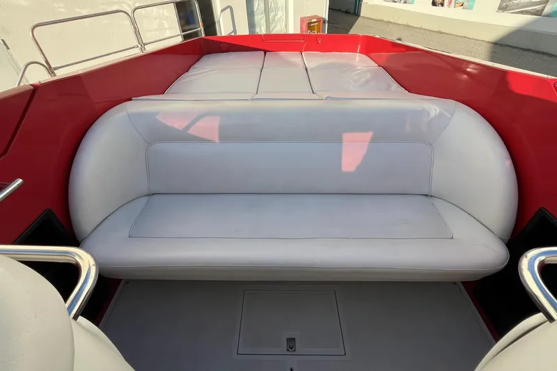  Yacht Photos Pics Interior of 1994 Riva 32 Ferrari Special boat with white seating and red accents.