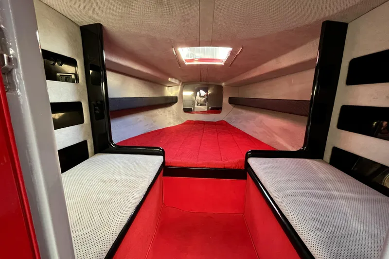  Yacht Photos Pics Interior of a 1994 Riva 32 Ferrari Special boat, featuring red and white upholstery.