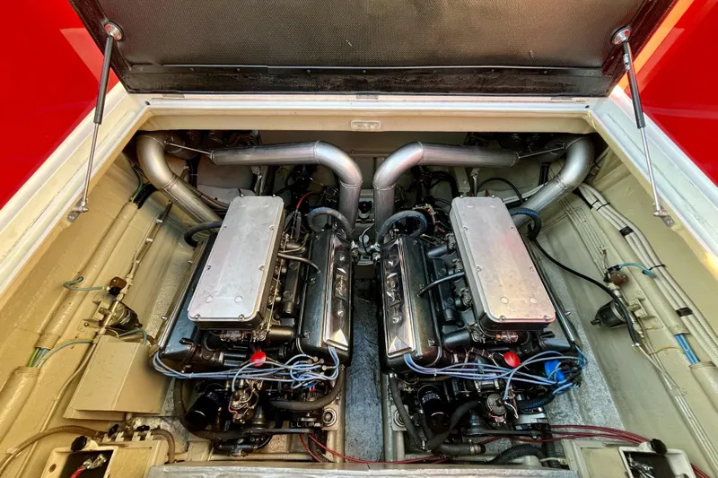  Yacht Photos Pics Engine compartment of a 1994 Riva 32 Ferrari Special, showcasing dual engines and intricate wiring.