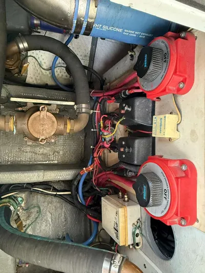  Yacht Photos Pics 1995 Luhrs Tournament 350 engine room with hoses and valves.