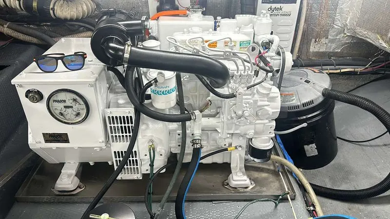  Yacht Photos Pics Engine room of a 1995 Luhrs Tournament 350 with generator.