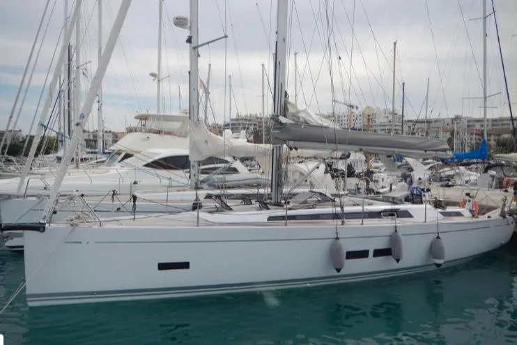 Nemo Yacht Photos Pics Grand Soleil 47 sailboat, 2015 model, docked in a marina with other boats.