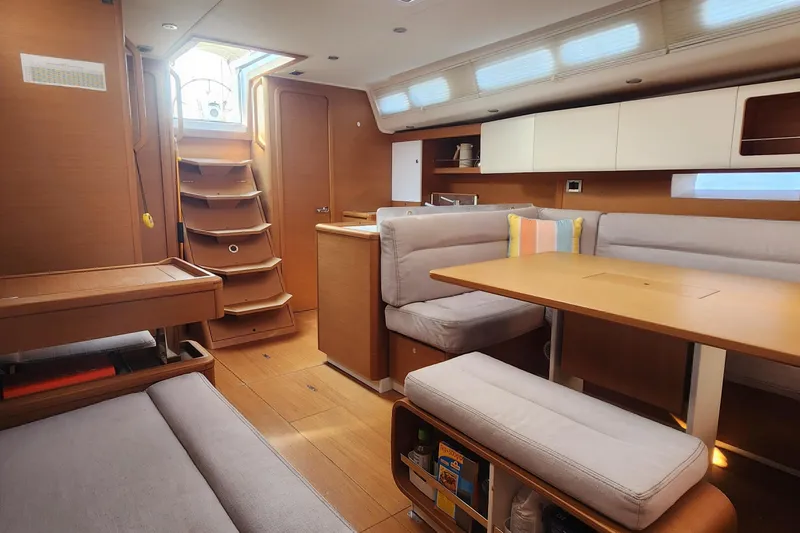 Nemo Yacht Photos Pics Interior of 2015 Grand Soleil 47 sailboat with modern wood finish and cozy seating area.