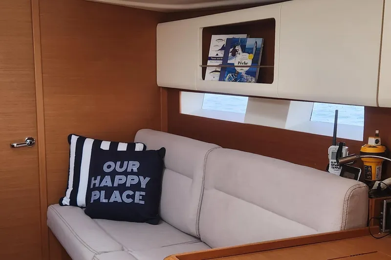 Nemo Yacht Photos Pics Interior of 2015 Grand Soleil 47 yacht with cozy seating and nautical decor.