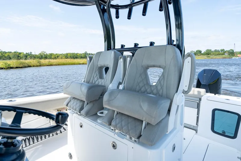  Yacht Photos Pics 2023 Sportsman Open 282 Center Console boat interior with plush seating and steering wheel.