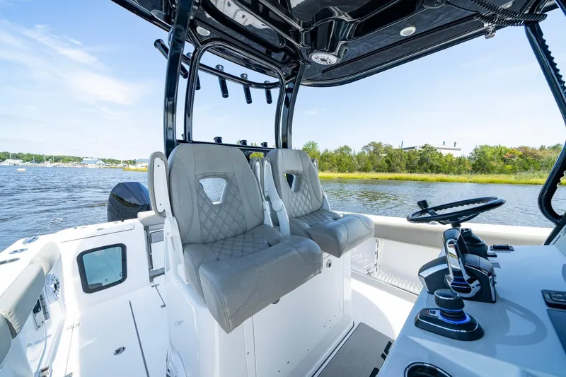  Yacht Photos Pics 2023 Sportsman Open 282 Center Console boat interior with dual seats and steering wheel.