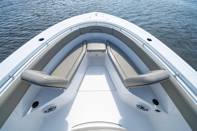  Yacht Photos Pics 2023 Sportsman Open 282 Center Console boat interior with cushioned seating on water.